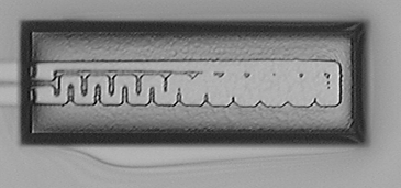 An example of incorrect shape of a heater, fabricated at the bottom of the 12 μm deep cavity.