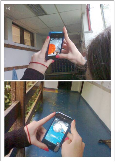 (a) Aluna observando a posi&ccedil;&atilde;o em tempo real do Sol de dentro da sala de aula, e (b) a mesma aluna apontado o celular para o ch&atilde;o e observando a posi&ccedil;&atilde;o da Lua abaixo do firmamento.