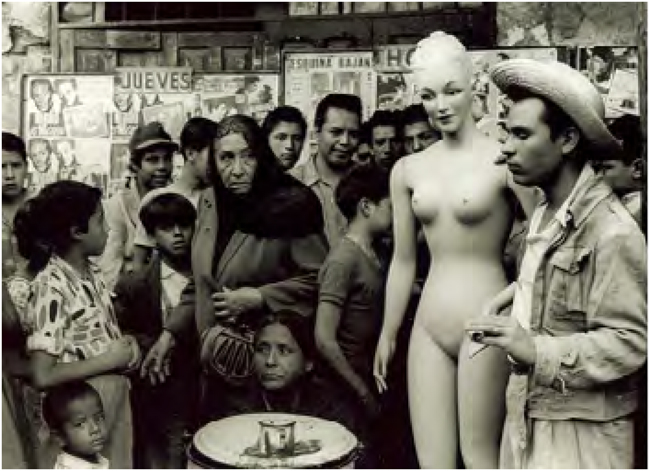 Nacho L&oacute;pez. Man with mannequin in a group, Mexico City, 1953. Fondo Nacho L&oacute;pez, INAH, Fototeca Nacional, 405642.