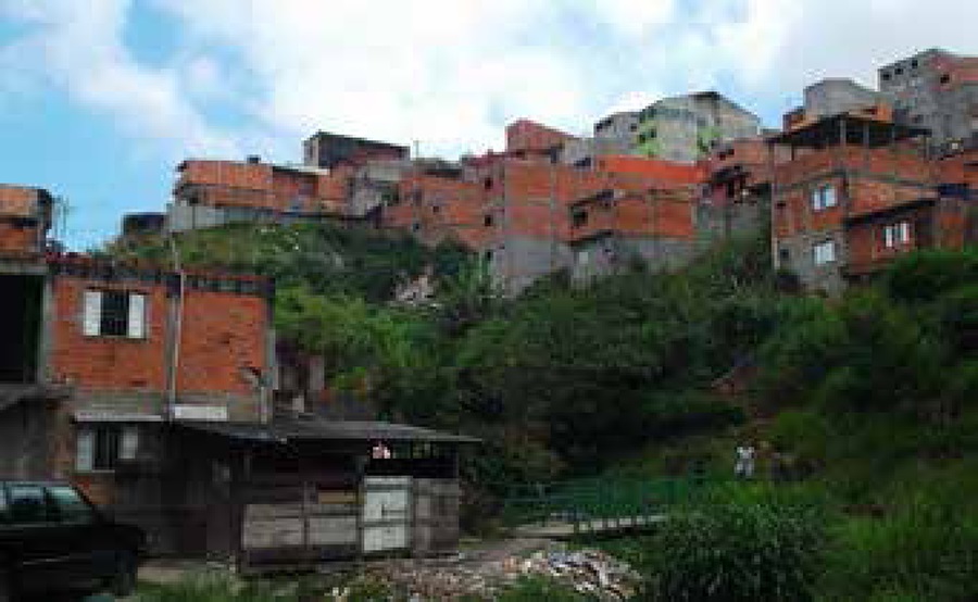 View of the school neighborhood from the school gate. The river
								runs under the bridge just beside the school