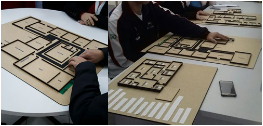 : Two APACE members analyze the tactile model design 1.