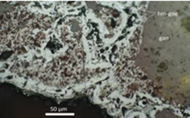 Agregados anhedrales de hematita - goethita (hm-goe) con textura zonal. Muestra S-2