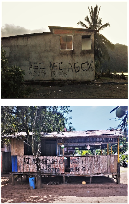 Grafittis de grupo armado en Ciudad Mutis y El Huína. Ciudad Mutis, 30/01/2020, 16h28m. y El Huína, 07/08/2022, 14h46m.: Las marcas que deja el conflicto armado y la ocupación paramilitar suelen ser "ocultas" o "sutiles", pero se pueden notar a través de algunos símbolos, como los grafitis, que en estas imágenes hacen referencia a un grupo armado