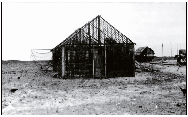 Constru&ccedil;&atilde;o de uma casa de taipa de m&atilde;o, Rio de Janeiro, 1950.