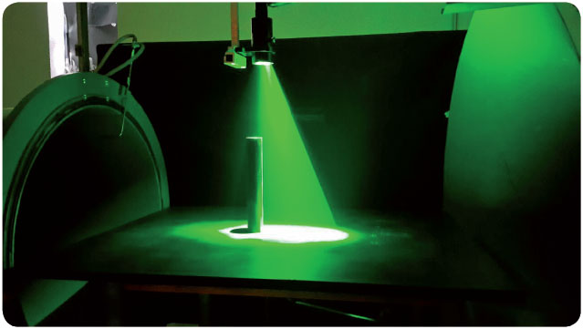 A cylinder model under the PIV laser sheet in the TA-3 wind
							tunnel.
