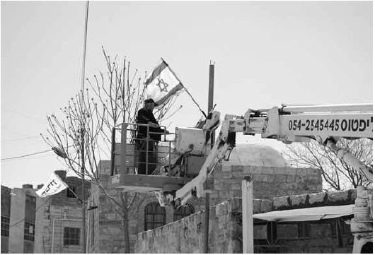 Hebron: Affixing Symbols on Architecture. Photo BSP