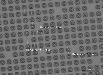 Example of incorrect photoresist patterning. Photoresist is still present (at the center of the dots) in the areas covered by the mask during first exposure dose. This problem was solved by adjusting the exposure dose.