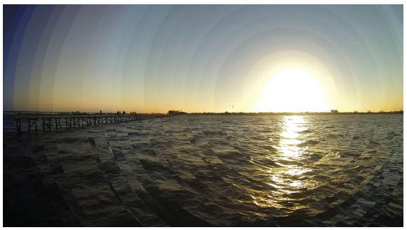 Justaposi&ccedil;&atilde;o de fragmentos circulares de imagens do p&ocirc;r do sol.