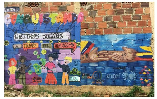 Representaci&oacute;n de la resistencia a la xenofobia: mural de Tejedores de Paz en uno de los barrios perif&eacute;ricos de C&uacute;cuta mostrando la solidaridad colombo-venezolana.