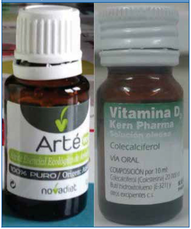 Envase de aceite esencial de árbol de té y envase de vitamina D (foto cedida por la familia de uno de los pacientes)