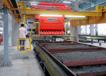 Automatizaci&oacute;n del proceso de hormigonado en los moldes. Fuente: https://www.youtube.com/VollertAnlagenbau