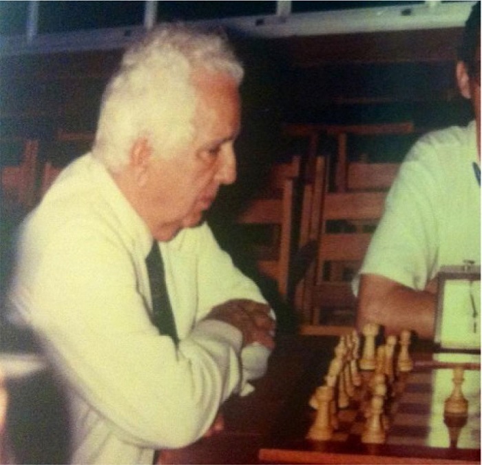 Luiz Tavares devoting himself to chess, his favorite
								hobby.