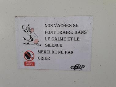 &ldquo;Our cows are milked in a calm and silent environment. Thank you for not yelling&rdquo;. Sign placed at the entrance of the human space of the robot. The installation of the robot does, in fact, attract visitors.