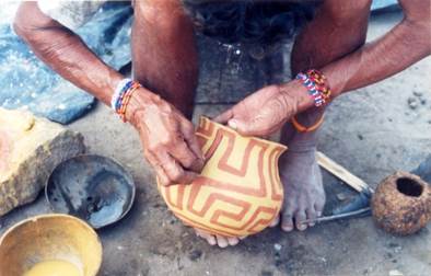 applying the yellow pigment and painting the tayngava
