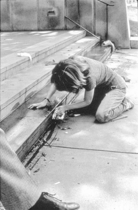 Mierle Ukeles (1973). Hartford Wash: Washing steps outside.