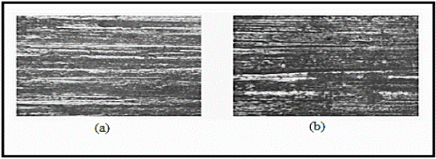 Traces of abrasive wear presented in ASTM A 532. (a) 650 &deg;C (holding time of 3 hours); (b) 350 &deg;C (holding time of 9 hours).