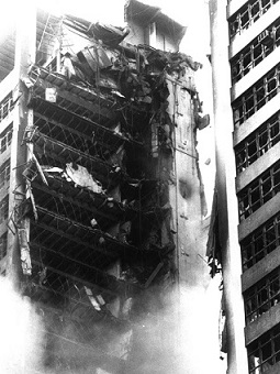 Detail of the Sede II building concrete structure collapse, showing the two remaining parts of the tower.