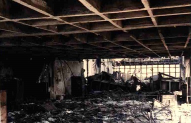 Front view of the Sede II building structure, from its rear, highlighting the void left by the collapse of the central part