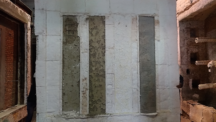 Detail of the elements and coatings condition after furnace opening (event 2): slow-set plaster coating, reference element, intumescent paint coating and cement-based mortar coating.
