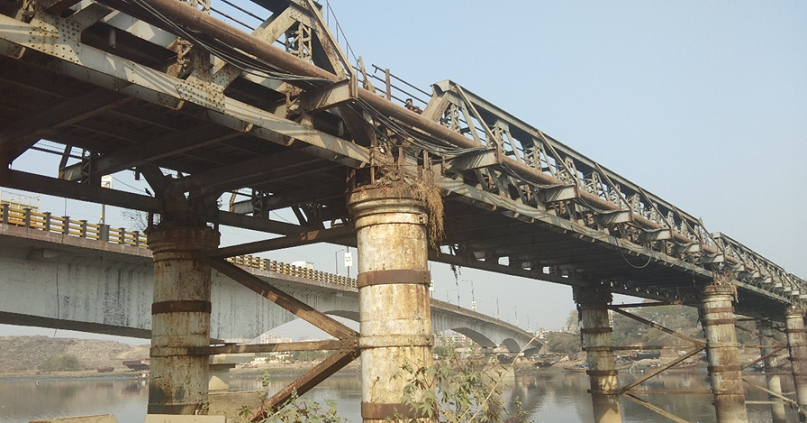 Photo of bridge showing warren truss type structure.