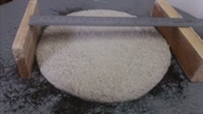 Slump flow test for consistency determination.