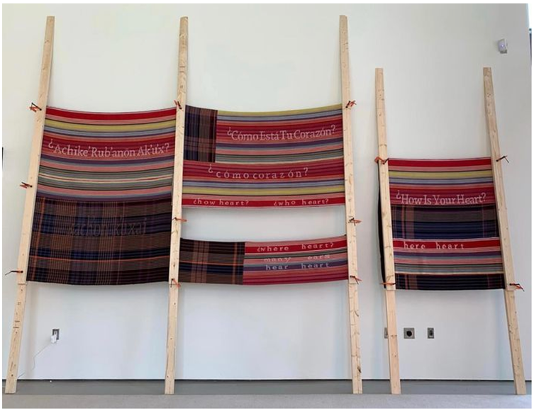 &ldquo;�C�mo est� tu coraz�n? &ndash; Achike&rsquo; rub&rsquo;an�n ak&rsquo;u&rsquo;x &ndash; How Is Your Heart?&rdquo;. Algod�n, lana, madera y abrazaderas, 503 x 503 cm Figure 1. &ldquo;�C�mo est� tu coraz�n? &ndash; Achike&rsquo; rub&rsquo;an�n ak&rsquo;u&rsquo;x &ndash; How Is Your Heart?&rdquo;. Cotton, wood, and clamps, 503 x 503 cm