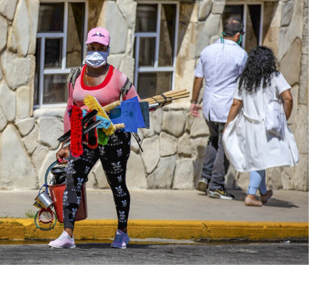 Doctors and pedestrian wearing face masks in Havana, Cuba during the COVID-19 pandemic.