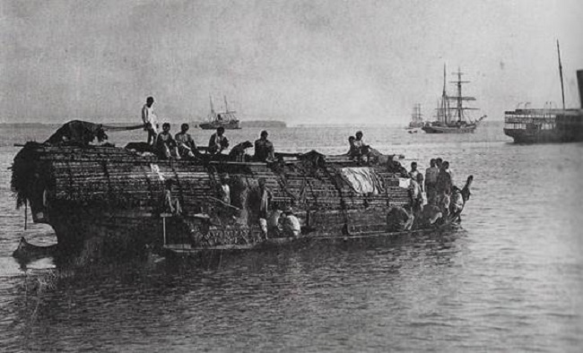 Canoe, steamship and sailships on the Amazon.
