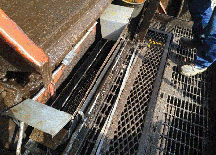 MAC Operation while drilling. Example of a MAC installed at the shaker. The container collects rocks before opening a gate to release them, and start a new time lapse for rock collection. Afterwards, the volume of rock is calculated using density and weight of the samples collected, and volumetric flow corresponds to this volume per time unit.