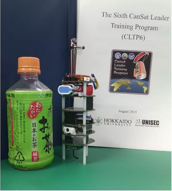 Assembly compared in size with a PET-bottle, and the cover page of the assembly&rsquo;s manual.