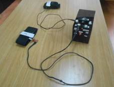 Final prototype. Top figure: Control unit that includes a 32-bit microcontroller, an XBee module, a LIPO battery, and connectors and LEDs indicators. Bottom figure: arm straps, IMUs and cables connected to control unit.