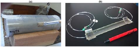 Manufacturing of the longitudinal sensor packaging probe. a. At first, unmolding film is placed around the rock sample, a FBG is placed on the film, after that the polymeric resin is spreading over the film and FBG; the GRP tape is placed over the FBG and the resin, finally more resin is spreading again to cover all packaging. b. After drying time, the FBG packaging is demolded.