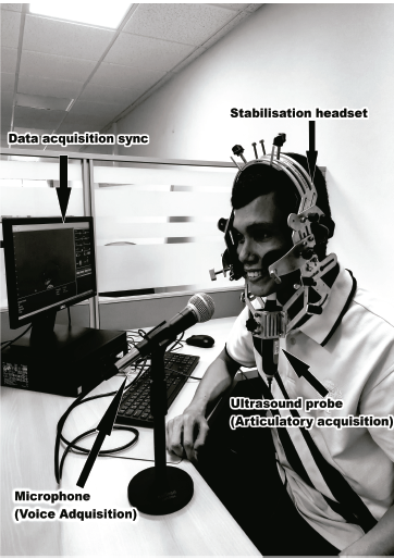 Equipment used for the parallel acoustic-articulatory data collection: microphone, personal computer, ultrasound probe and stabilization headset.
