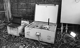 CAMKIT device installed in the enclosure of the photovoltaic hybrid system during transmission testing.