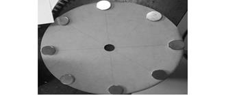 Arrangement of magnets in a wooden base diameter of 29 cm spaced at 45 &deg;.