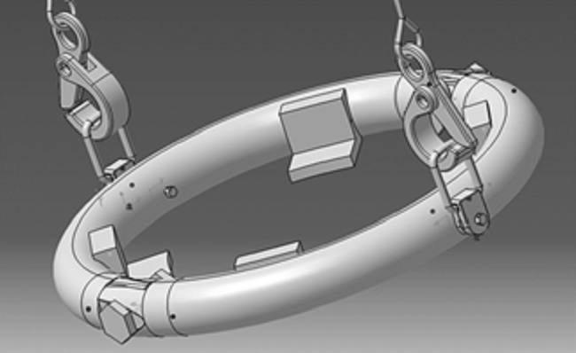 Projection of swing clamping ring hanging from steel cables.