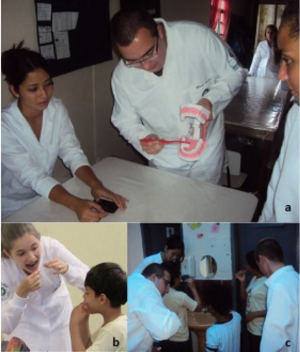 Figura
1. Oficina de higiene oral realizada por alunos ingressantes em Odontologia durante
as atividades do Trote Solidário. a) Treinamento dos alunos ingressantes para
instrução de higiene bucal com uso de macromodelos de arcada dentária e
escovas. b) Aluna ingressante do curso de Odontologia orientando o uso de fio
dental para cada criança atendida pela Casa Acolhedora. c) Alunos ingressantes
do curso de Odontologia orientando e supervisionando escovação dentária de crianças
e adolescentes na Casa Acolhedora.