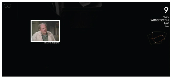 Exibição de um trecho de programa de TV que cita Ravel e Paul Wittgenstein.