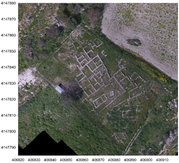 Ortophoto of the sacred area at Vassallaggi archaeological site. Surrounding the small temple in antis (built in the 6th century) is a network of buildings that most likely had a productive and commercial function linked to the activities of the temple itself which welcomed the faithfuls.