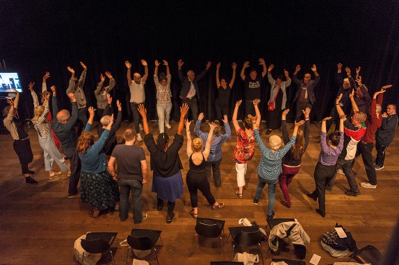 The closing circle where performers and audience reenact some of the gestures that they have experienced in the performance at Liverpool Arab Arts Festival 2019 ©Jazamin Sinclair.