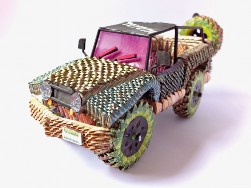 Art Sculpture of a Toyota 4x4 vehicle made from Bolivars by one of Cúcuta's money artisans. Collected in 2019 by Art For Impact.
