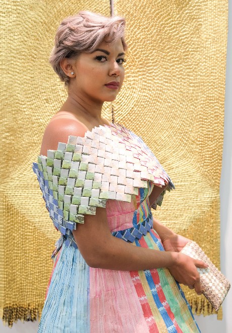  Bolivar Dress Nery Santaella poses with a dress made out of Venezuelan Bolivars with origami details from Art For Impact at Artbo in 2019. Concept: Jason Rovig.