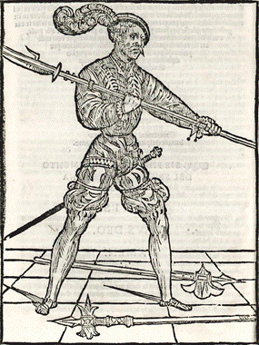Woodcut from Achille Marozzo&rsquo;s chapter &ldquo;On the fighting with the bill one versus one&rdquo; in his Opera Nova. Notice the additional weapons on the floor, most likely linked to his statement in Capitolo 185, wherein their manner of use is stated to be the same as the bill's. Achille Marozzo, Opera Nova, (Modena: Bergolae, 1536), cap. 184.