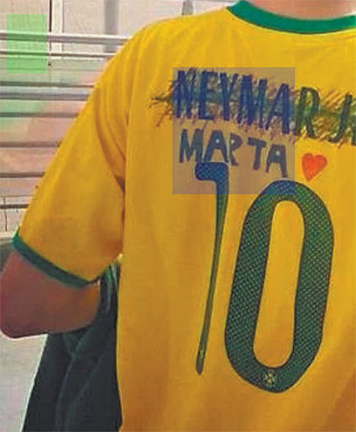 Fan wearing the Brazilian soccer team jersey, extracted from the report B29.
