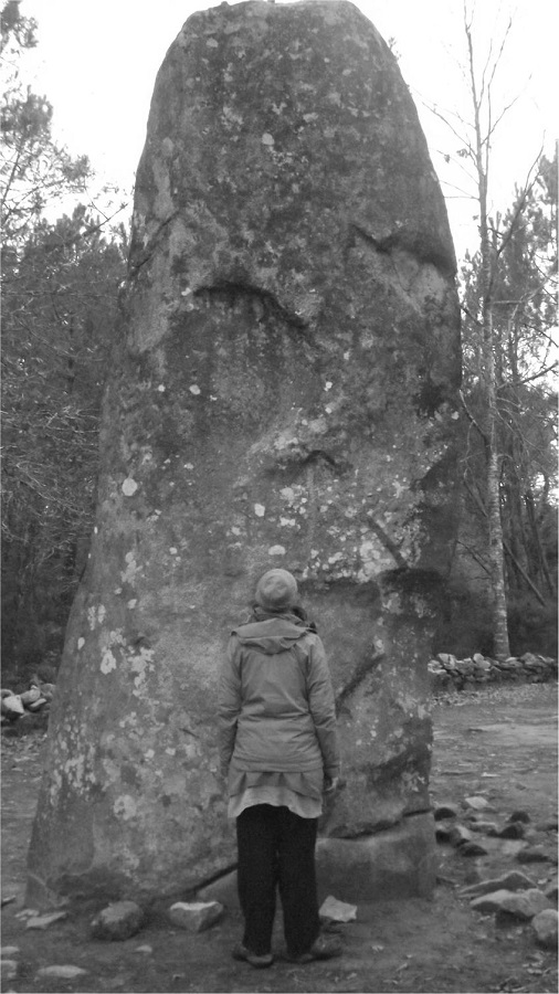 A participant touching the megalith with her forehead.