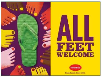 Feet, of different colors, around a pair of Havaianas, accompanied by the words &lsquo;All feet welcome&rsquo;.