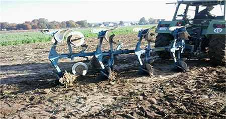 Reversible moldboard plow with 4 working organs during ploughing. Source: Author's file.