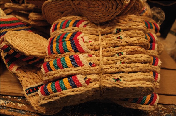 Natural vegetable fibers are transformed into utilitarian handcrafted espadrilles and home artifacts for peasants and farmers. Pasto, Colombia.